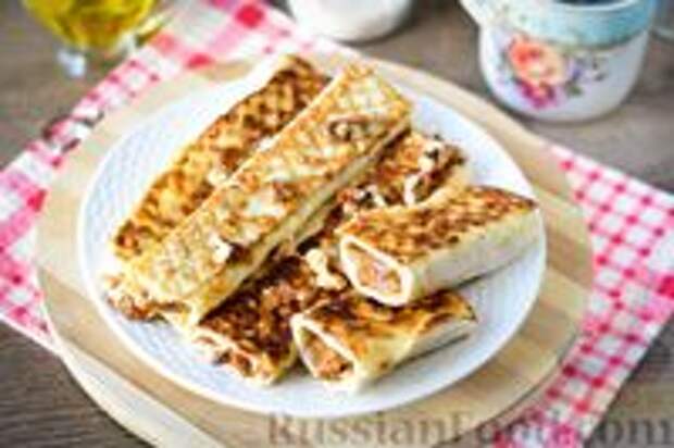 Фото к рецепту: Рулетики из лаваша со сгущёнкой и орехами