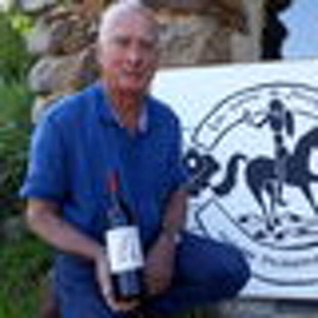 Hervé Garnier with a bottle of his forbidden wine.
