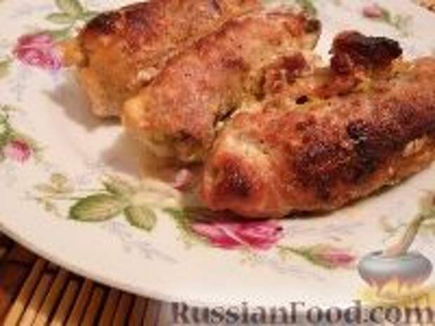 Фото к рецепту: Мясные рулетики с грибами, сыром и яйцом