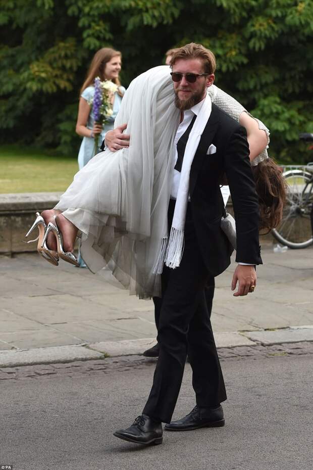 One guest was kind enough to sling his female friend over his shoulder as the effect of her heels began to kick in