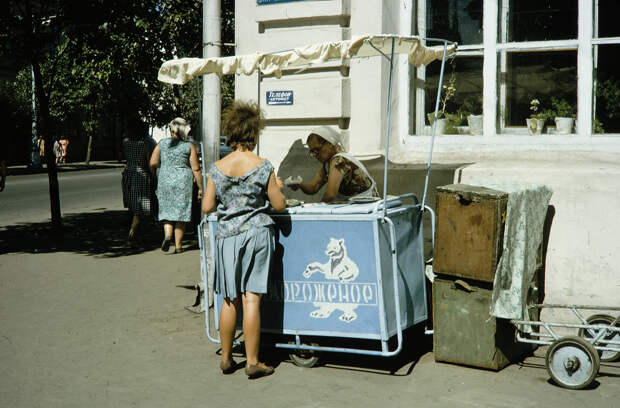 Russia, woman purchasing item from street vendor. Siberia Russia, woman purchasing item from street vendor. Siberia
