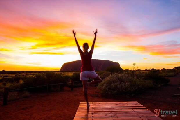 Yoga during sunrise at Uluru, Northern Territory, Australia