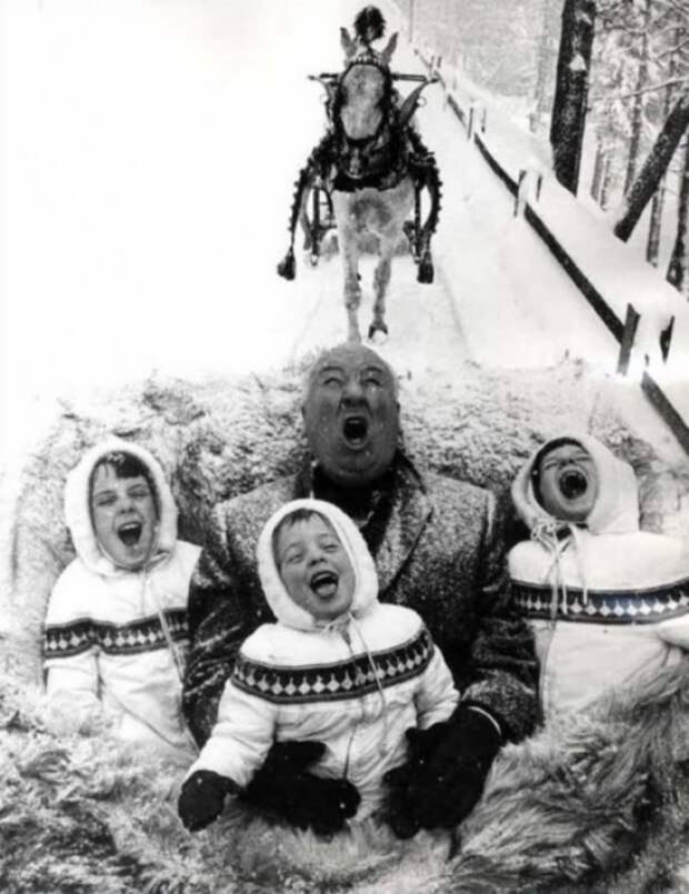 Alfred Hitchcock playing with his grandchildren, 1960.