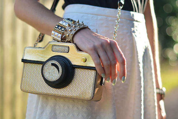 White skirt, camera cross body bag
