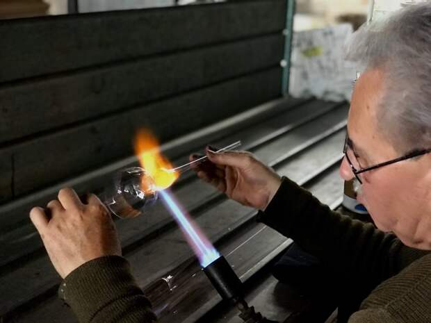 Juan Manuel Muñoz makes a glass bell at his factory on the outskirts of Chignahuapan, Puebla.