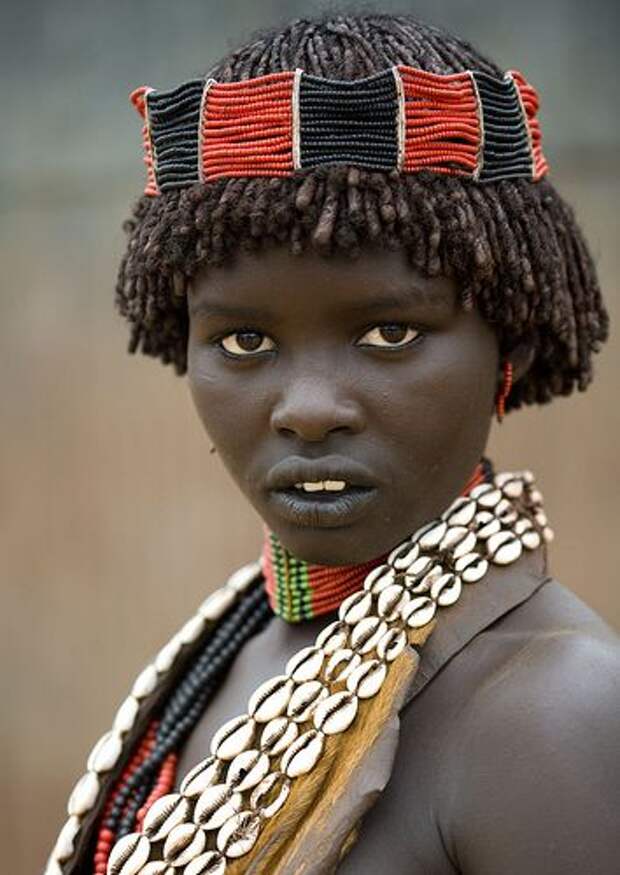 Adorned girl from Hamar tribe, Ethiopia.