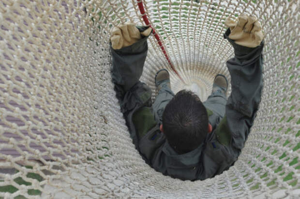 Whiteman Air Force Base, Mo. - An Airman of Whiteman, descends down the fire escape from the Whiteman tower, 22 Sept. .  Anyone who works in the tower needs to go through this training to ensure they know what to expect in the descent of the extreme drop. (U.S. Air Force Photo by Airman First Carlin Leslie)