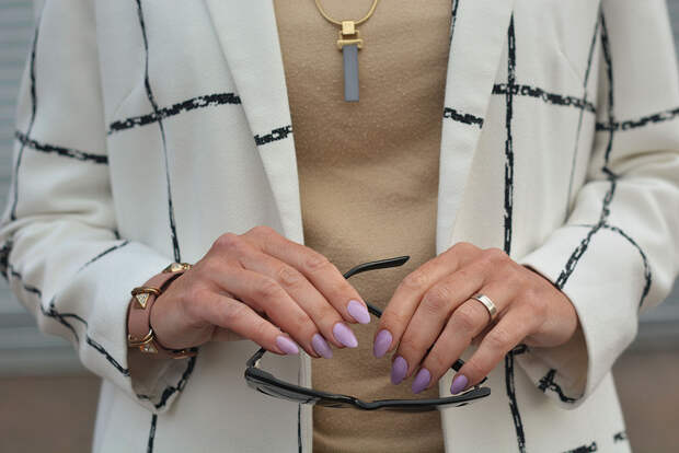 Black and white window-pane check coat, taupe sweater