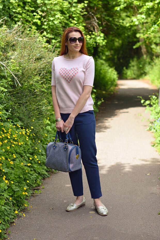 Pink motif sweater and loose navy pants