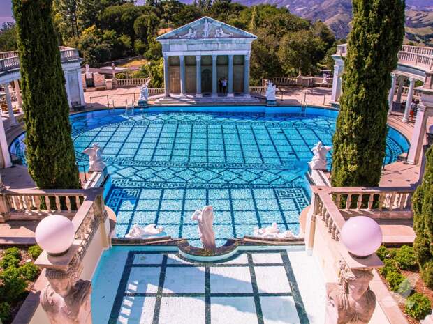 the-neptune-pool-sits-in-the-historic-hearst-castle-in-san-simeone-california-designed-by-architect-julia-morgan-in-1924-the-pools-main-centerpiece-includes-part-of-the-facade-of-an-actual-ancient-roman-temple-purchased-
