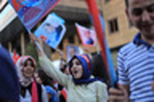 Aug. 13, 2014 - Istanbul, Turkey - A Turkish girl wears a head band that reads ''Recep Tayyip Erdogan'' as she holds Turkey flag during a rally march for celebrate presidential victory of Erdogan in Istanbul August 13, 2014. Erdogan secured his place in history as Turkey's first directly elected president on Sunday, sweeping more than half the vote in a result his opponents fear heralds an increasingly authoritarian state. (Credit Image: © Ahmed Deeb/NurPhoto/ZUMA Wire)