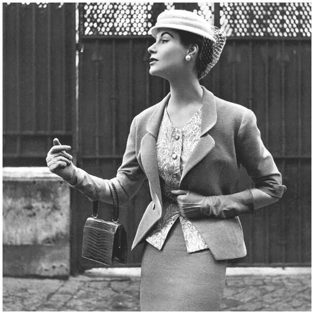 Myrtle Crawford in beige Ottoman suit with fitted jacket indented to v, worn over print cashmere top and narrow skirt by Manguin, hat by Paulette, croc bag by Morab.jpg