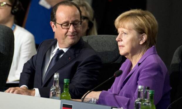 France's president Francois Hollande With Germany's chancellor Angela Merkel at the Nato summit