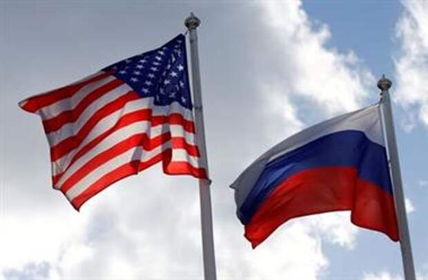 FILE PHOTO: Russian and U.S. state flags fly near a factory in Vsevolozhsk, Leningrad Region, Russia March 27, 2019. REUTERS/Anton Vaganov/File Photo 