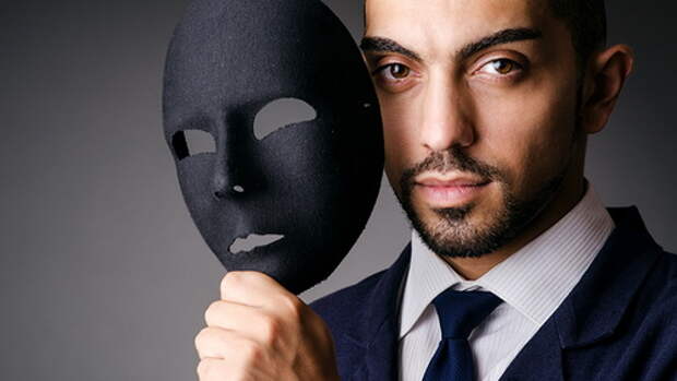 Man with black mask in studio