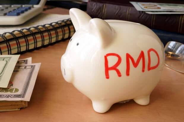 A piggy bank with the letters RMD written on it in red.