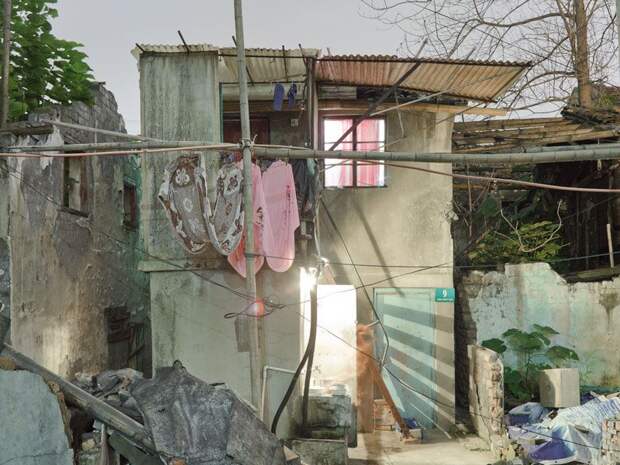 Трущобы упрямых китайцев, отказывающихся переселяться в квартиры (23 фото)