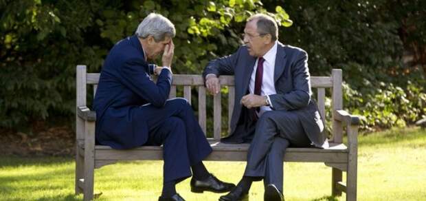 U.S. Secretary of State John Kerry (L) and Russian Foreign Minister Sergey Lavrov chat at the Chief of Mission Residence in Paris