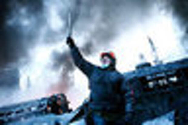 DATE IMPORTED: January 25, 2014 A man reacts at a barricade near the site of clashes between anti-government protesters and riot police in Kiev January 25, 2014. Ukrainian President Viktor Yanukovich, in what appeared to be an offer of concessions to the opposition amid violent protests against his rule, pledged on Friday to reshuffle the government next week and to amend sweeping anti-protest laws. REUTERS/David Mdzinarishvili