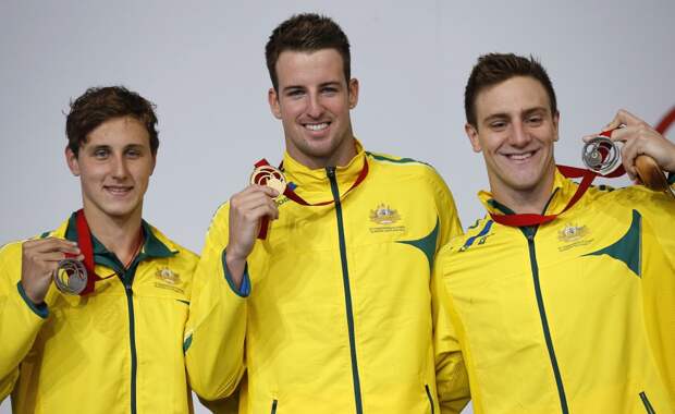 Australia's gold medallist James Magnussen (C) poses with silver medallist Cameron McEvoy (L) and bronze medallist Tommaso D'Orsogna after men's 100m Freestyle final at the 2014 Commonwealth Games in Glasgow, Scotland, July 27, 2014. REUTERS/Jim Young (BR