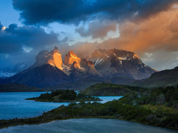 Torres Del Paine, Chilean Patagonia The famous Torres Del Paine centerpiece ó Cuernos del Paine. This was the early morning sun hits the face of the mountain, and the dark stormy clouds glows and popes up! #chile #cuernos #lake #patagonia #pehoe #salto grande #south america #travel #Cuernos #TorresDelPaines #adventure #chile #clouds #light #national park #nature #canon #canonmk5d3 #outdoor #outdoors #patagonia500 #storm