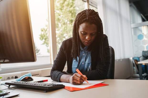 Woman highlighting a document.