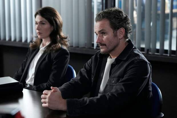 Bruno sitting with somebody at a meeting on Law & Order: SVU Season 26 Episode 12