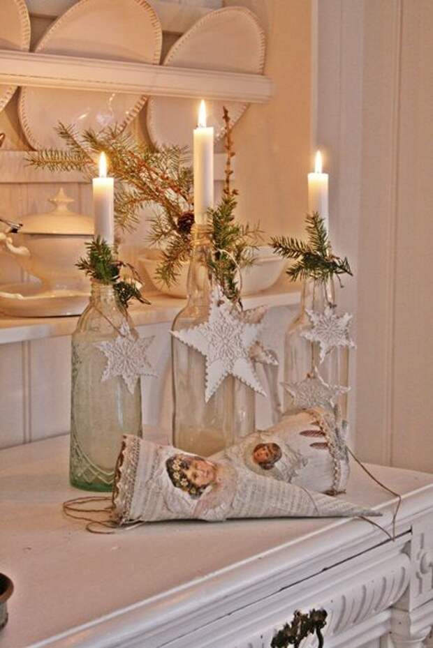 Candles and stars cute beginning to an idea for centerpieces, either put in middle of table or place on a mirror.  then use old bottle as shown i would then add votive candles all around these. this would also be so cute for New Year's Eve party.