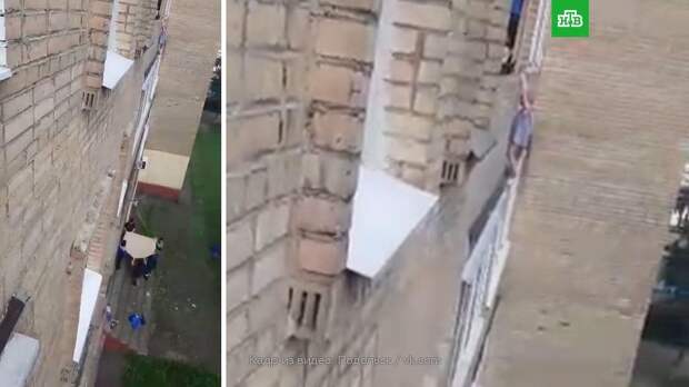 Сын пьяной матери 15 минут висел на карнизе и был спасен дворниками: видео