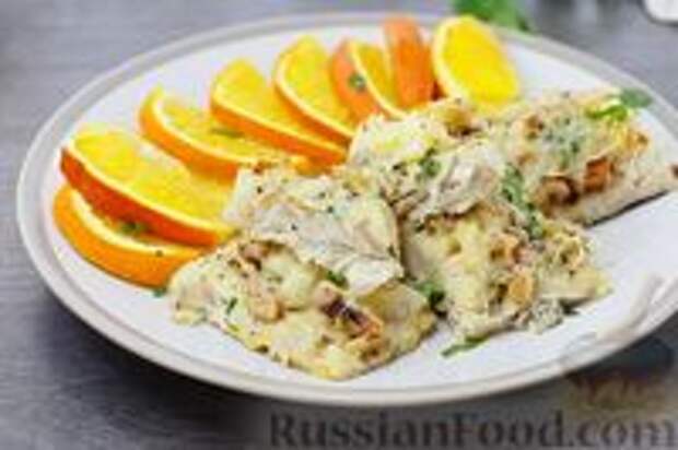 Фото к рецепту: Рыба с апельсинами, сыром и орехами (в духовке)