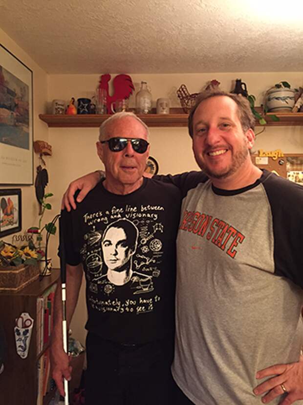 a photograph of John Gardner on the left and his son Dan Gardner on the right