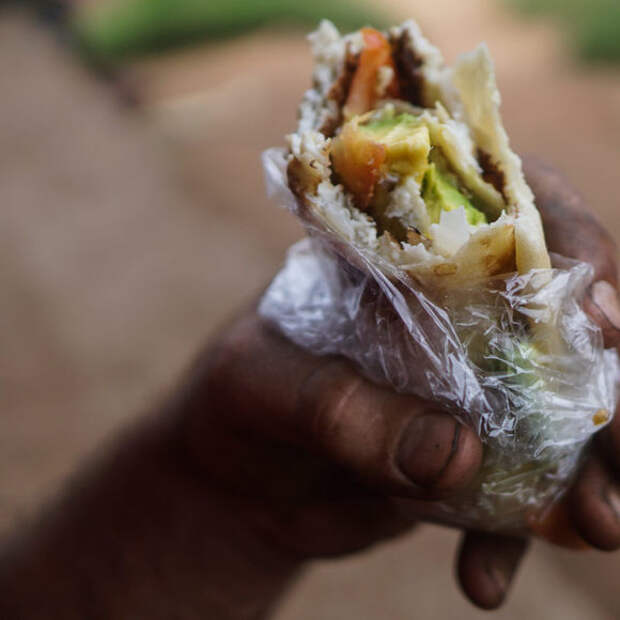Your friendly rolex chef will commonly add chopped tomatoes and onions to your omelette, and if you bring an avocado like we did, they'll chop that into your rolex too!