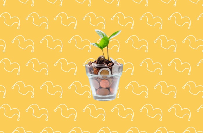 A pot of change with a plant growing out of it