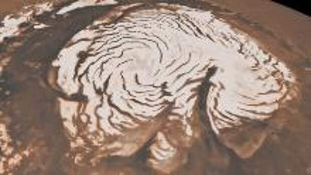 This image, combining data from two instruments aboard NASA's Mars Global Surveyor, depicts an orbital view of the north polar region of Mars. The ice-rich polar cap is 621 miles across, and the dark bands in are deep troughs. To the right of center, a large canyon, Chasma Boreale, almost bisects the ice cap. Chasma Boreale is about the length of the United States' famous Grand Canyon and up to 1.2 miles deep.