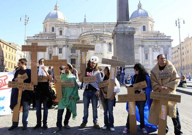 Protesters of the 'Indignant' group prepares to take part in a demonstration against banking and finance in Rome