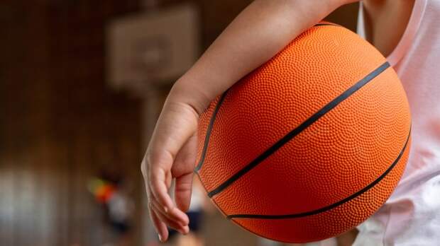 kid holding basketball