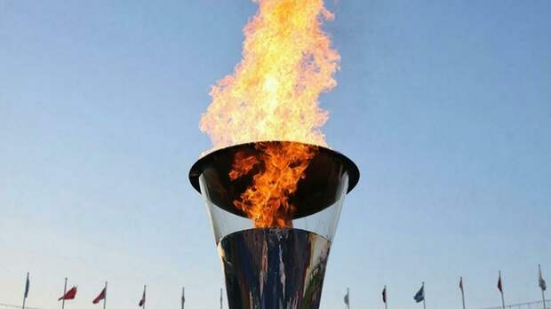 Олимпийский огонь на стадионе / Фото: создано в нейросети