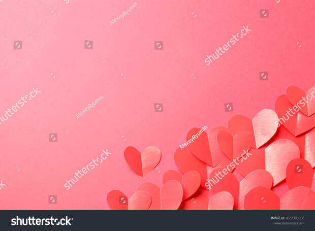 Cut out of red paper hearts on pink background. Good Valentines day, Womans day, love, romantic or wedding composition with empty space for custom text for banner, congratulation, card, offer, flyer, advertising, invitation.