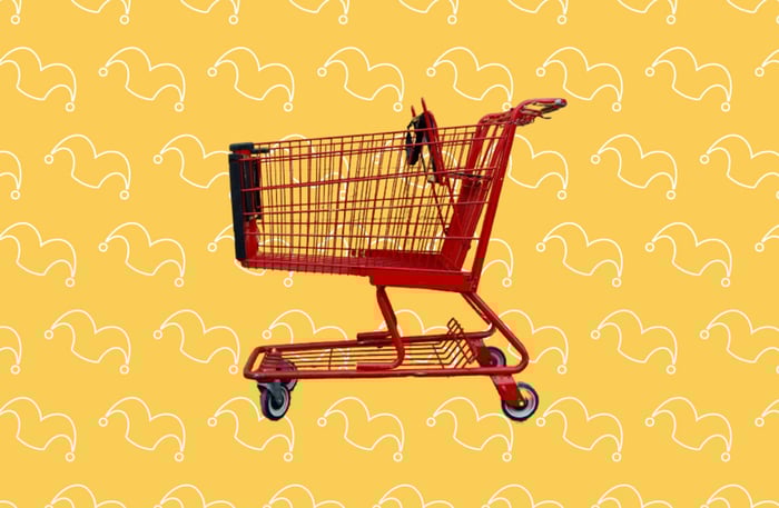 A red shopping cart against a yellow background