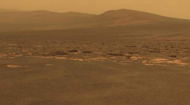 A portion of the west rim of Endeavour crater sweeps southward in this color view from NASA's Mars Exploration Rover Opportunity.