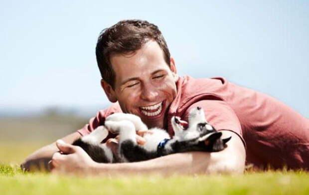 shutterstock-man-dog-playing