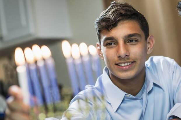 Hanukkah family celebrate Jewish holiday menorah.jpg