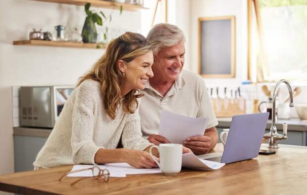 Two people at a laptop.