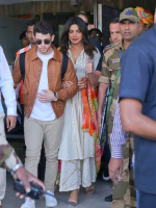 Nick Jonas, Priyanka Chopra. Bollywood actress Priyanka Chopra, center and musician Nick Jonas, left, arrive at the airport in Jodhpur, Rajasthan, India, Thursday, Nov.29, 2018. The couple who in August announced on their respective Instagram accounts that they are engaged are reportedly here for their wedding People Chopra Jonas, Jodhpur, India - 29 Nov 2018