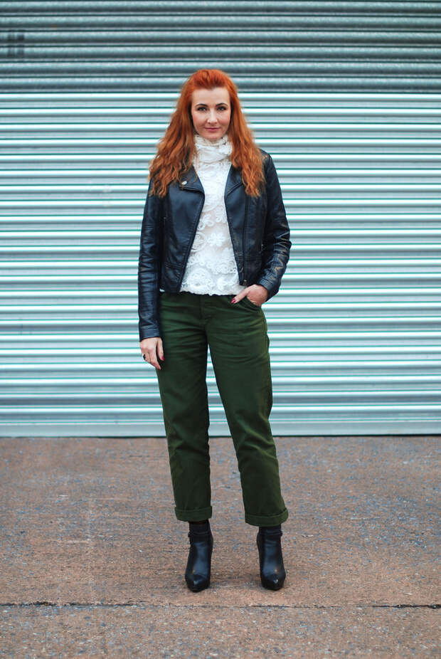 Biker jacket with white floral sweater and army green trousers