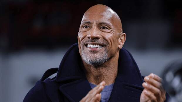 Dwayne Johnson on sideline during XFL game