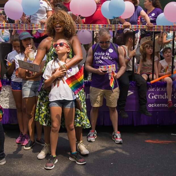 A parent and child take part in a Pride march in New York City. This previously unpublished photo was taken as a part of Lynn Johnson's coverage for the January 2017 cover story on gender.