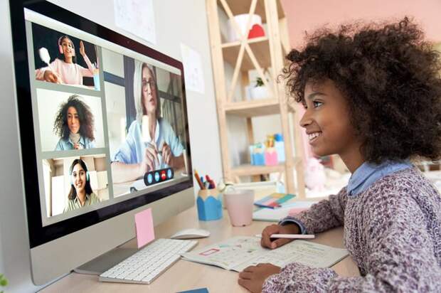 Child interacting with others on the computer. 