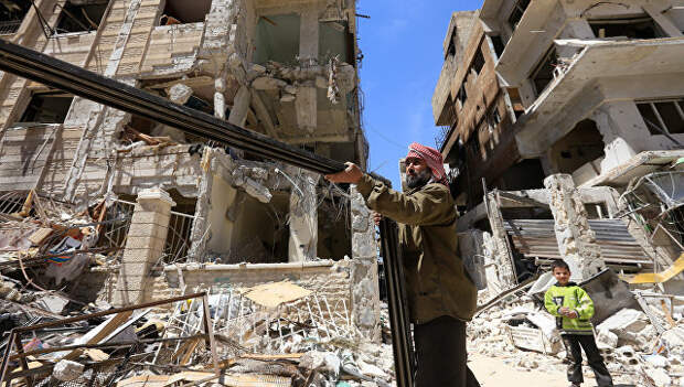 Разрушенные здания в Думе. Архивное фото